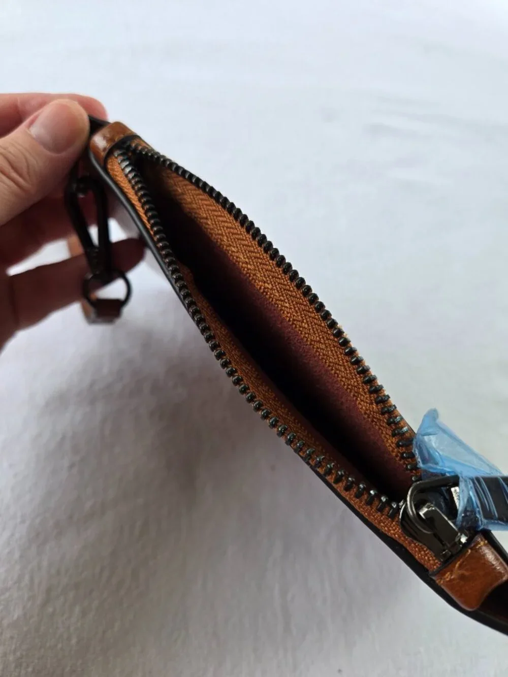 Unsigned leather wristlet